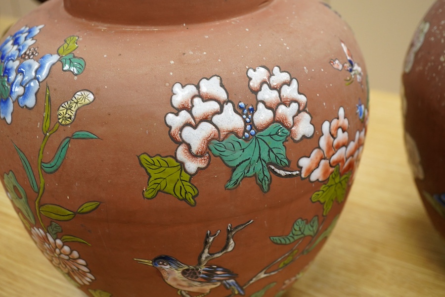 A pair of Japanese enamelled terracotta jars, c.1900, 26cm high. Condition - fair to good